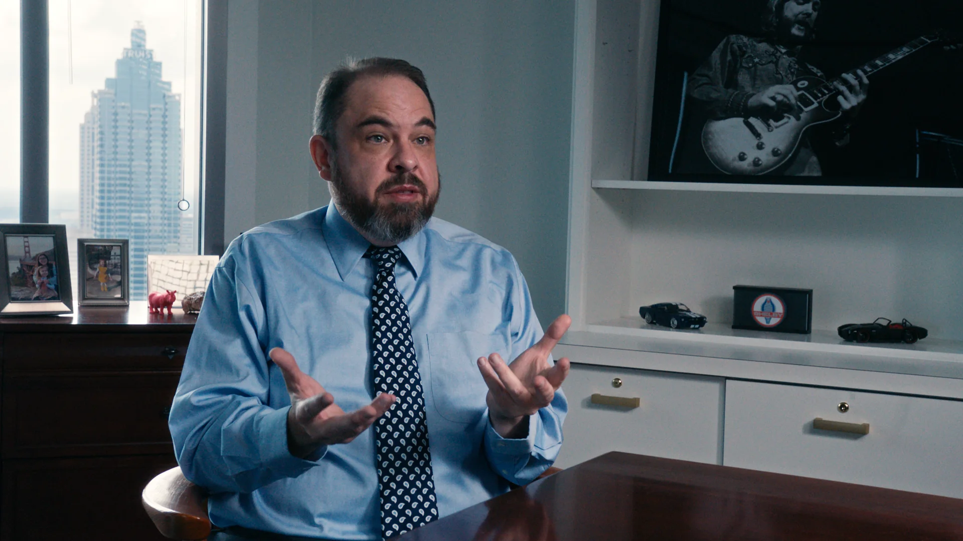 Attorney explaining law firm video marketing strategy in an office interview