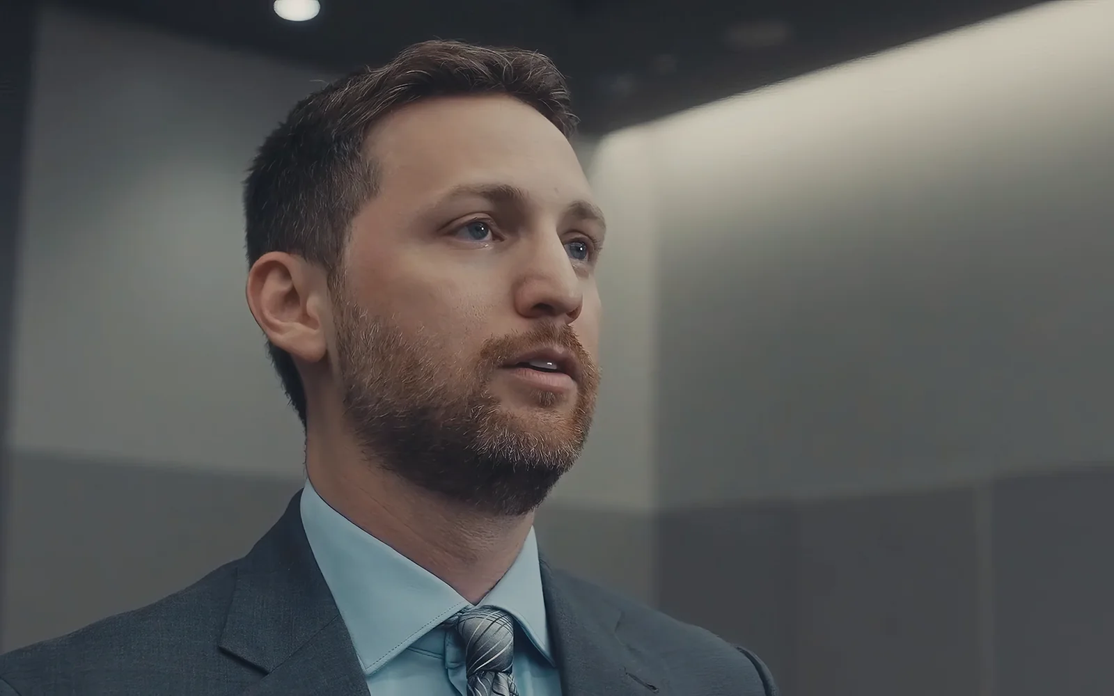 Attorney portrait filmed from a polished low angle for a profile video