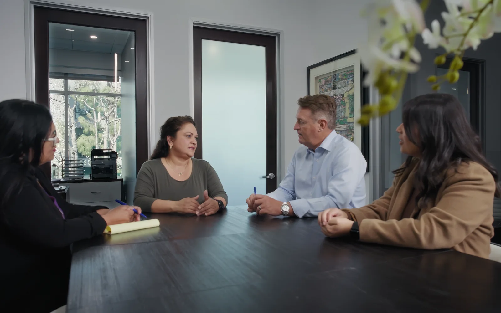 Law firm team meeting captured for modular attorney profile video content