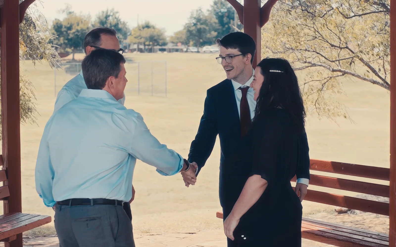 Law firm client greeting attorneys in a candid brand video scene