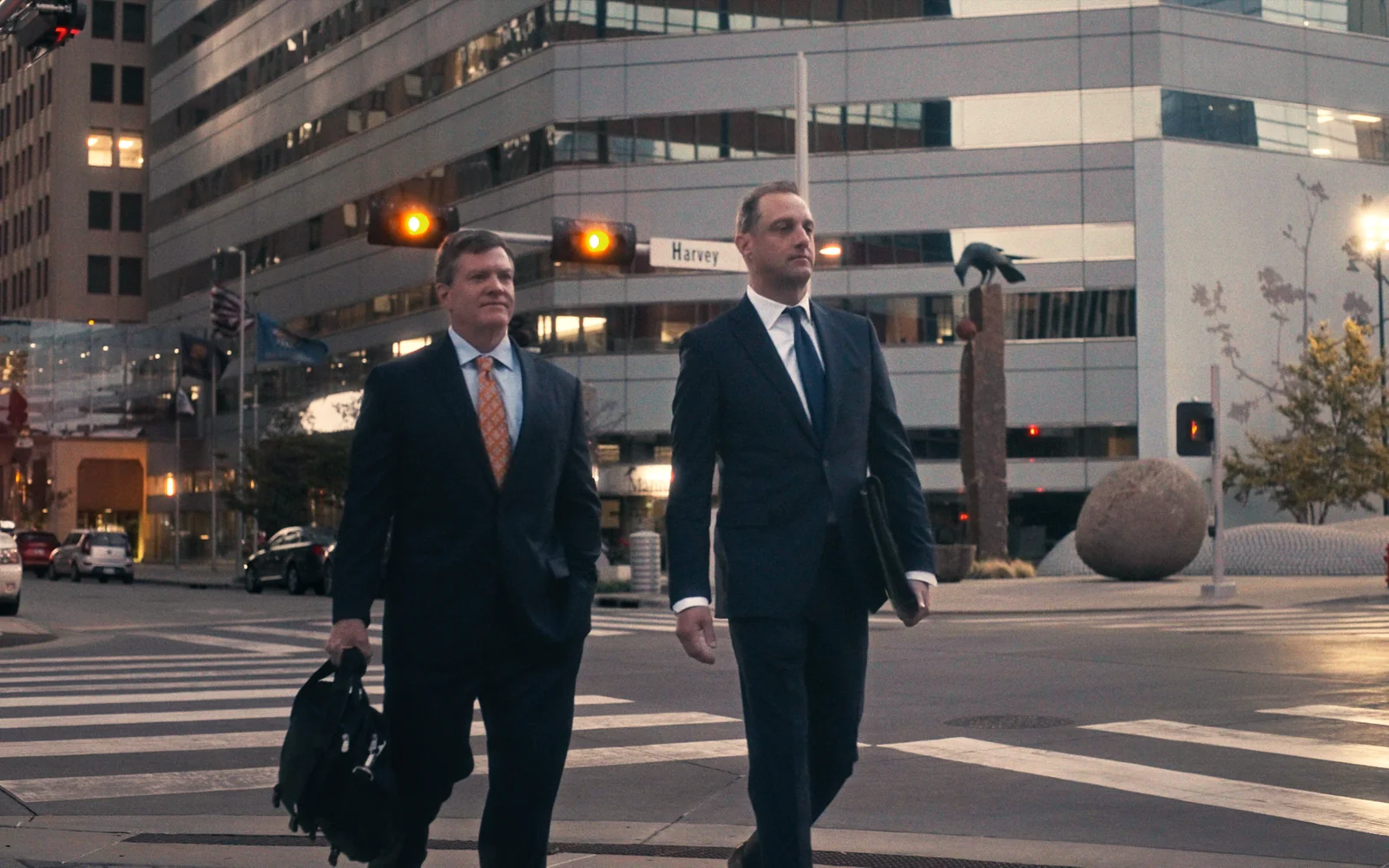 Two attorneys walking through downtown in a cinematic law firm brand video still