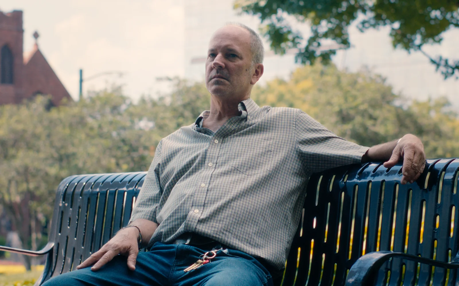 Client seated on a bench during a law firm testimonial video interview