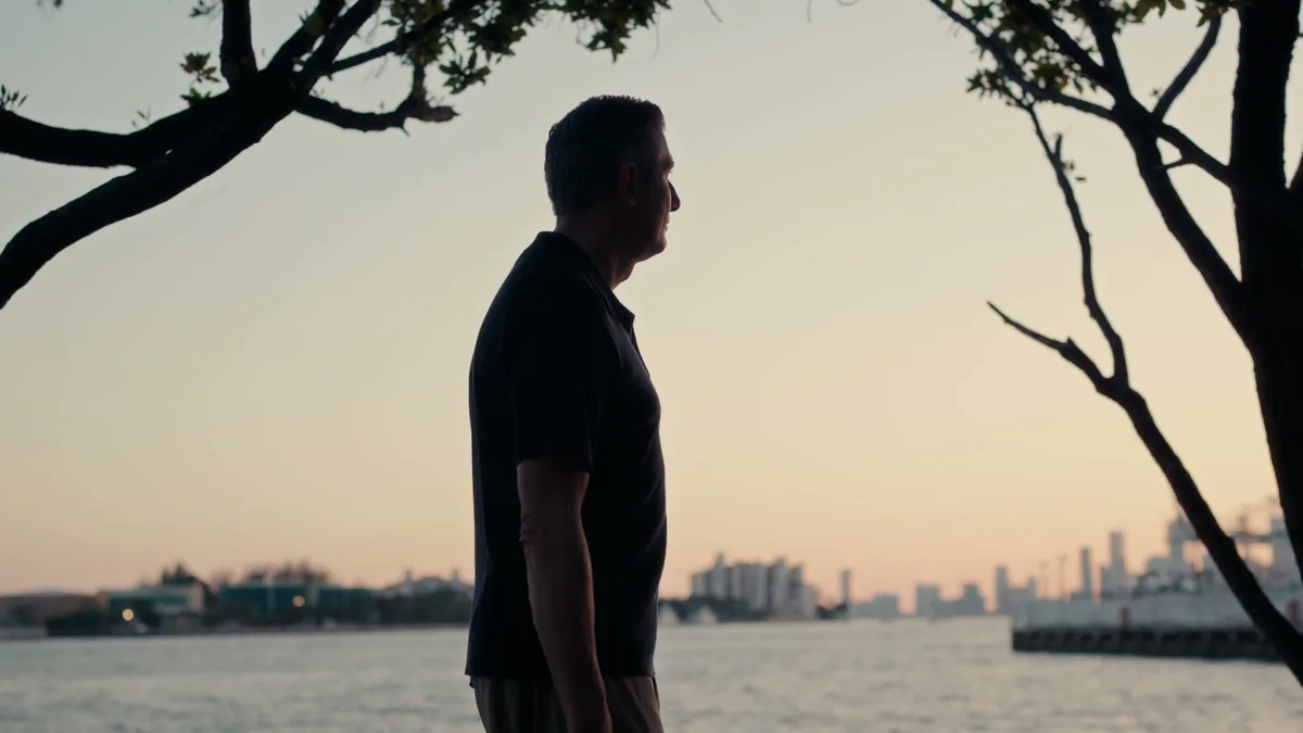 Michael Padula attorney profile thumbnail. Profile shot at dusk beside the water, a man in a dark polo shirt with tree branches framing the shot.