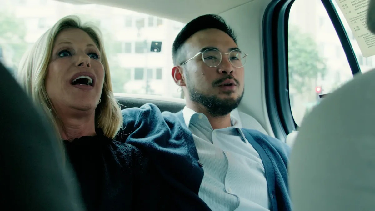 Kevin Patrick Law practice area video thumbnail on rideshare accidents. Two people sit in the back seat of a car, buildings and trees visible through the windows.