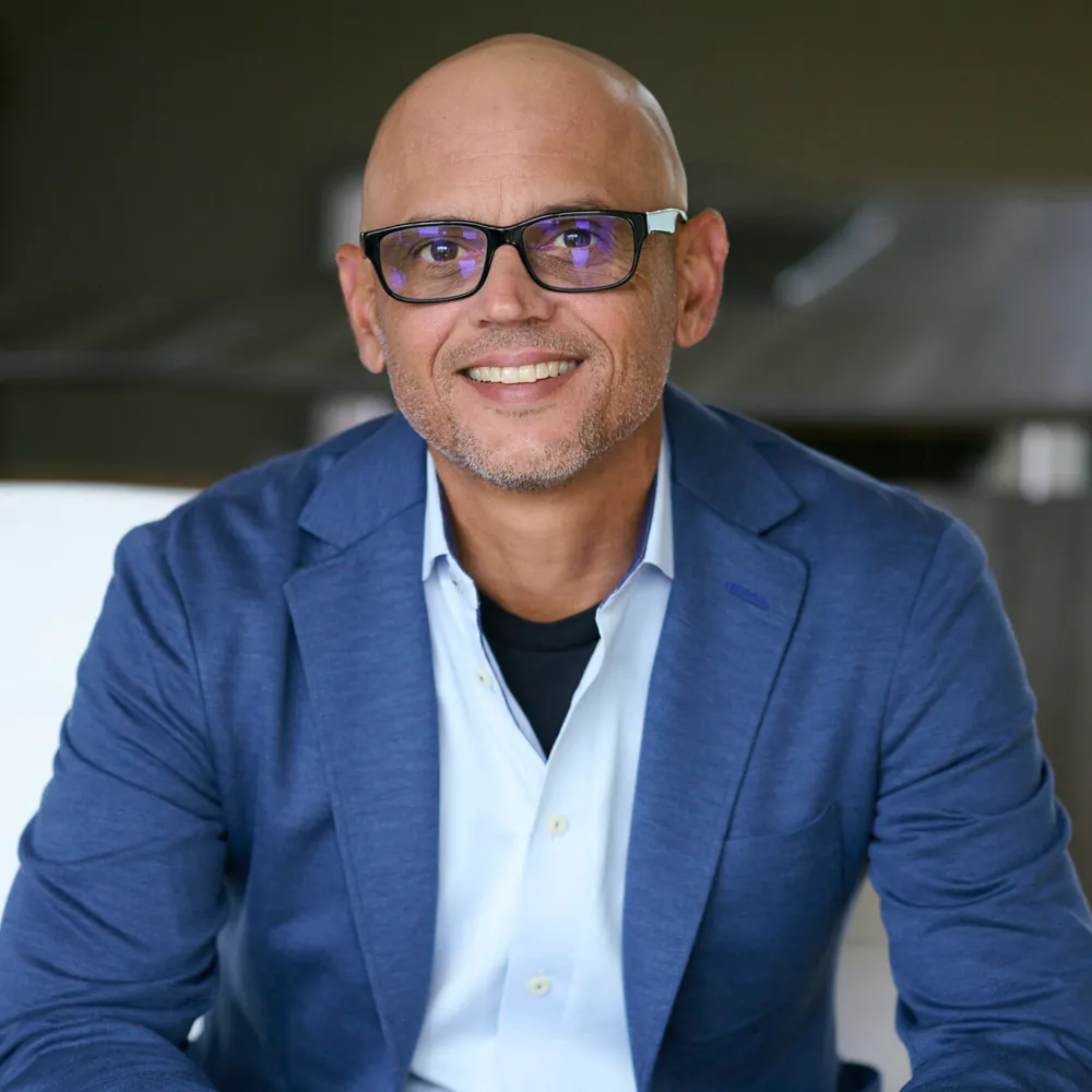 Tony McGinnis of Spark Blue, an agency partner of Story First, smiling in a professional headshot